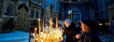 Believers light candles during the service for Orthodox Epiphany celebrations in the Nasterea Domnului Cathedral in Chisinau in January.