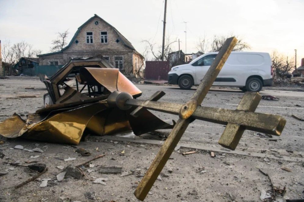 A Cross and dome of the Orthodox church destroyed by the Russian army in Hostomel, Ukraine - фото 97725